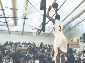 Taking the Leap: Freshman Daniel Sutherlin takes a shot at Monday night’s basketball game against Grand Valley State. Sutherlin’s slam dunk in the first half helped the Bulldogs along their path to a 67-41 victory. Photo By: Kate Dupon | Photographer