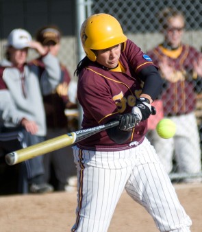 Grand Slam: Senior Rhea Flores, pitcher for the softball team, keeps her eyes on the ball at a recent game. Flores pitched a four hitter against West Georgia leading to a 4-3 victory. Photo courtesy of Ferris State Athletics